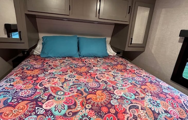 Comfortable upgraded king mattress and storage galore, outlets & USB on both sides, two windows with roller black-out night shades