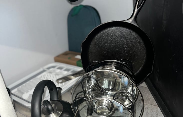 A cast Iron, Pots, Pans and lids come included as well. Dish soap, A drying rack with additional sponges are available too.