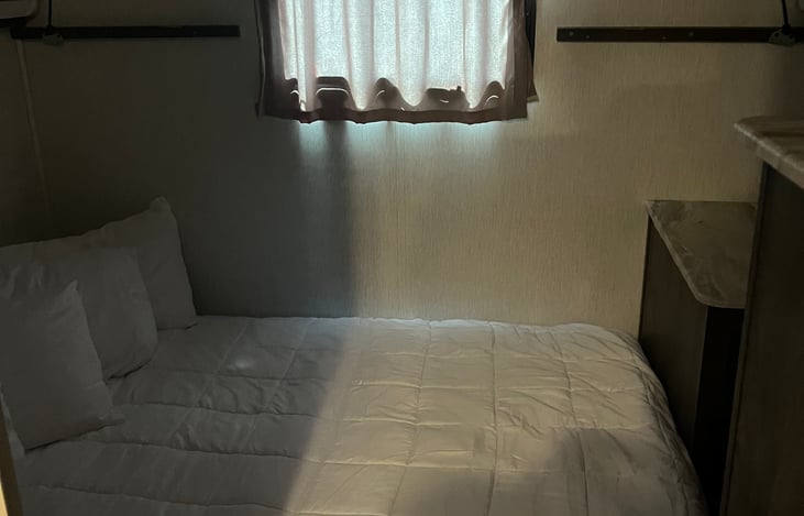 Rear couch opens to queen bed in rear