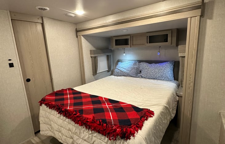 Queen size bed in only bedroom. Reading lights on both sides.