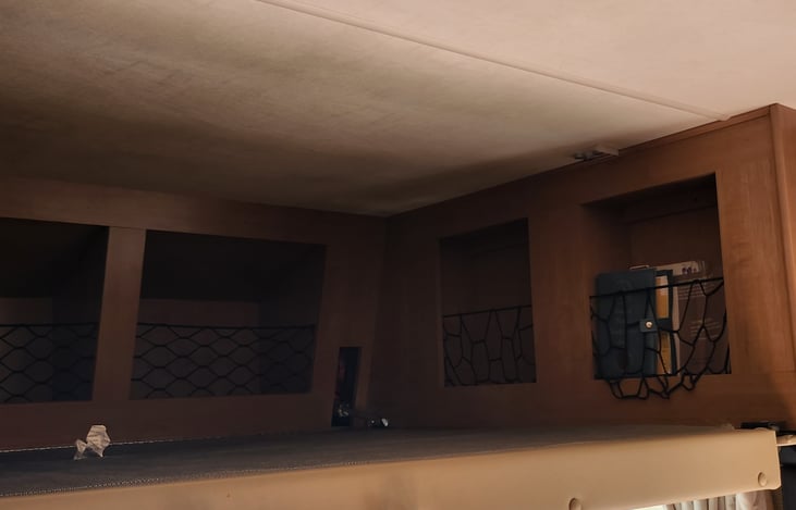 fold-away double bed above driver seats