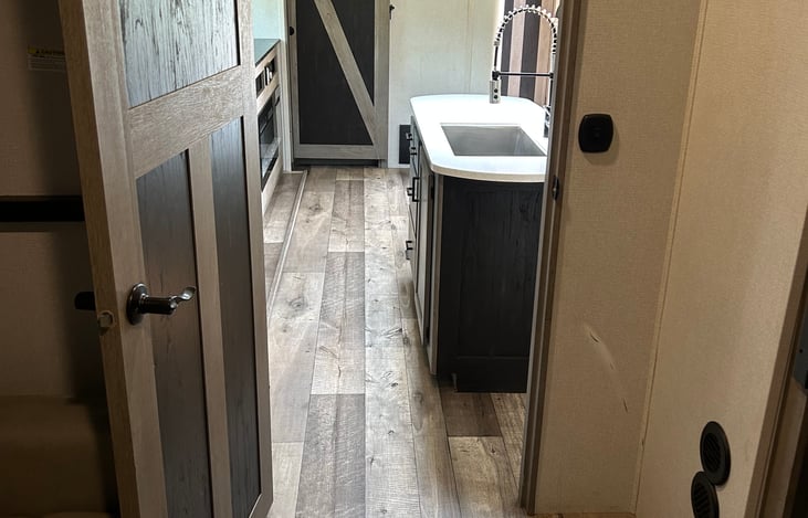 Spacious galley and fully-equipped kitchen. Plenty of room for everyone. Private bunkhouse and private bedroom on opposite ends. Pop-up TV to keep everyone entertained. Ample storage.