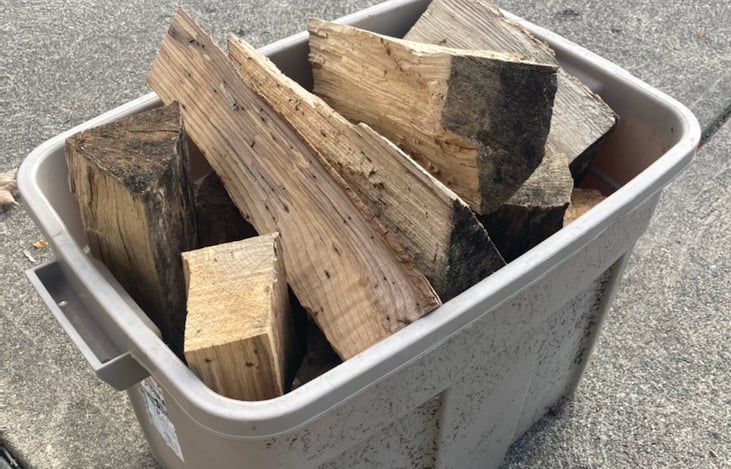 TOTE FULL OF FIREWOOD