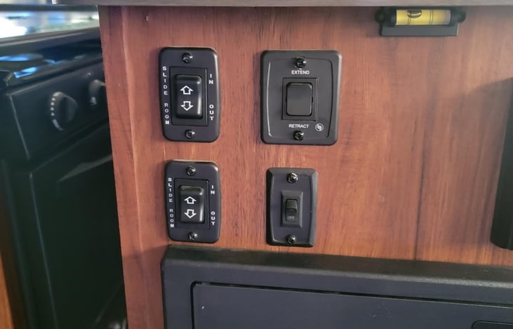 Controls for the slides
Awning and a light
fuse panel
