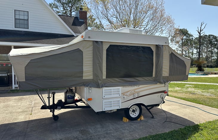Backside of camper when popped up.  This is where you hookup the 120 volt electrical and water.