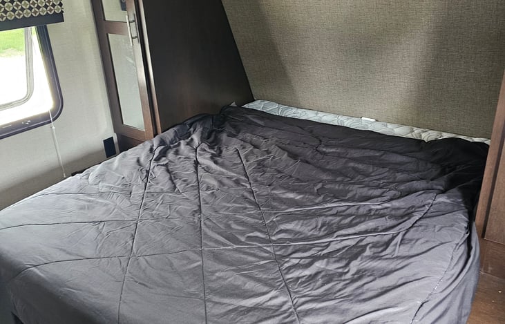 Queen Size bed with TV in room