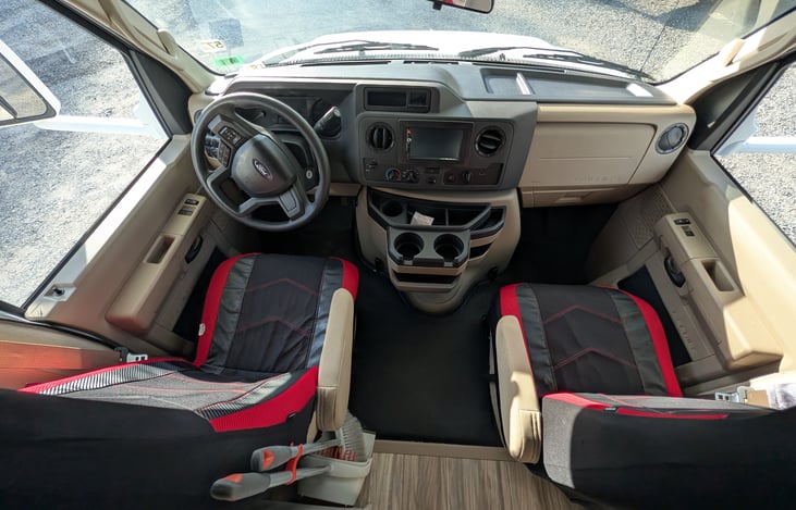 Comfy cockpit features Ford V8 power, touchscreen dash with Bluetooth, and integrated backup/side-view cameras for stress-free driving. Captain's chairs provide great visibility for the road ahead!