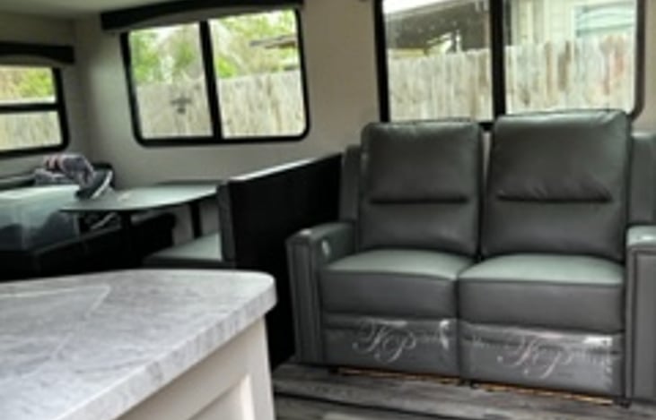 Recliners have a heat and massage function and are lighted at the bottom. They extend to almost flat.