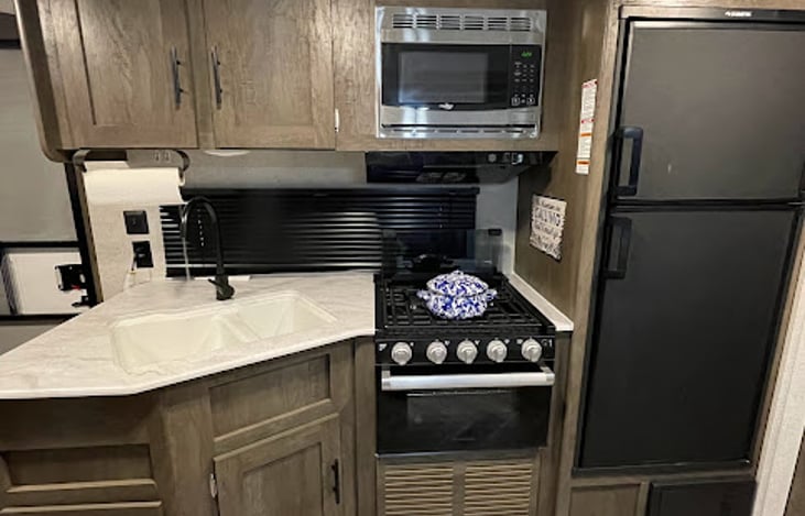 Great Kitchen w/ 3 Burner Stove + Oven.  Fridge/Freezer Combo