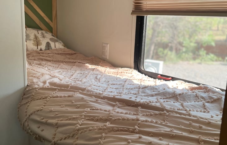 2 separate bunks with 4" foam mattresses with privacy curtain