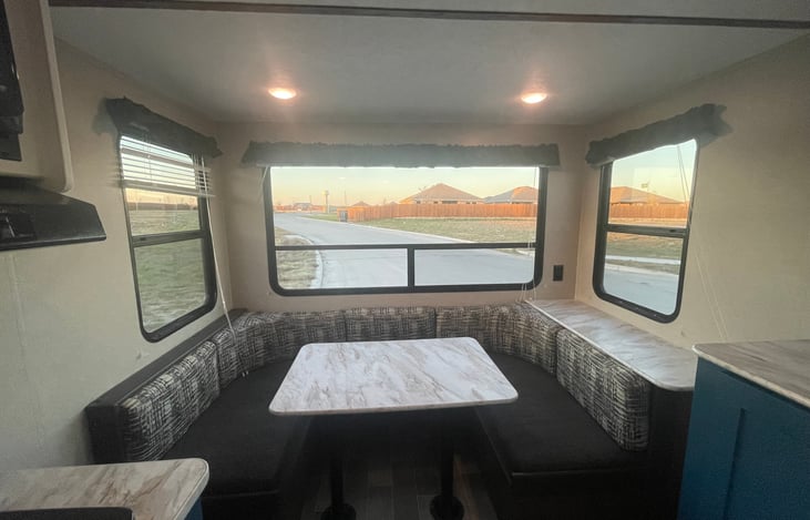 Dinning area that converts into a full sized bed and has additional storage underneath.