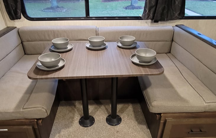 U-Shaped dining table with under-seat storage. This converts into a full size bed.