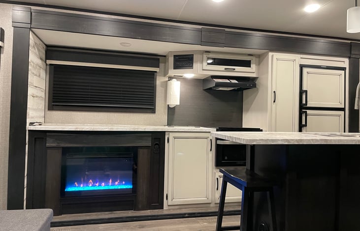 Fireplace and kitchen with TV Down allows for tons more counter space