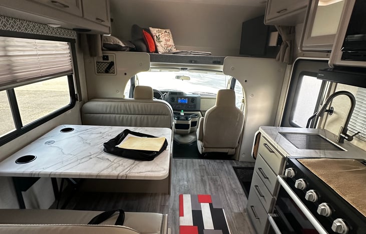 Kitchen area includes, microwave, oven, 3 burner stove,  Refrigerator and freezer>. Kitchen essential also included.