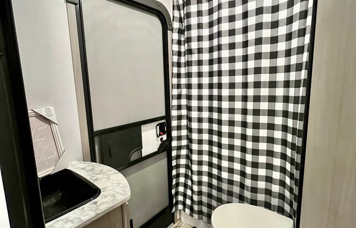 Bathroom with sink, shower, and toilet