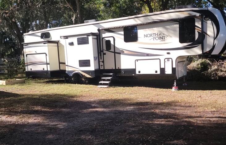 The last slide has an outdoor kitchen.  The Kitchen includes a TV, Stove, Fridge, storage, and ice maker.