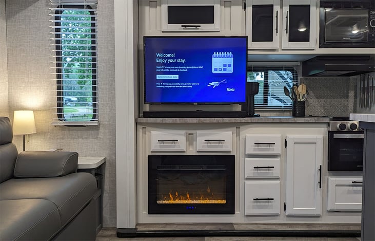 Entertainment center with 39" TV, soundbar, Roku and electric fireplace with optional heat