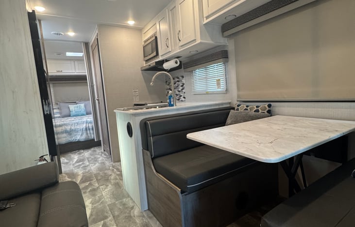 Nice dinette area to eat and enjoy meals also converts to a bed if needed