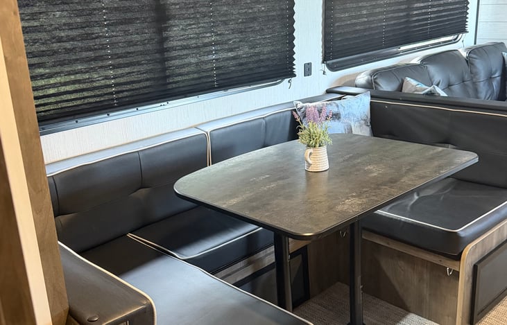 Dining area. Able to be converted to sleeping area. Added doors for easy access to underwear storage.