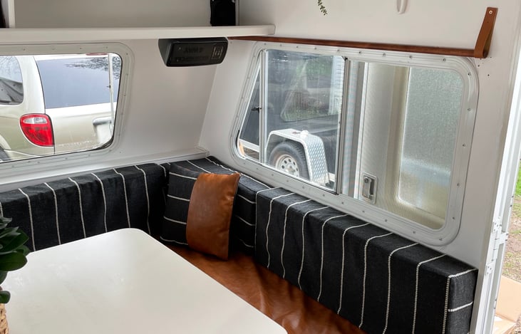 Access to storage under front bench seat for longer items (chairs, ores, fire tripod, outdoor games, outdoor rugs)
Storage baskets above
AM/FM radio (cassette player + blue tooth adapter)