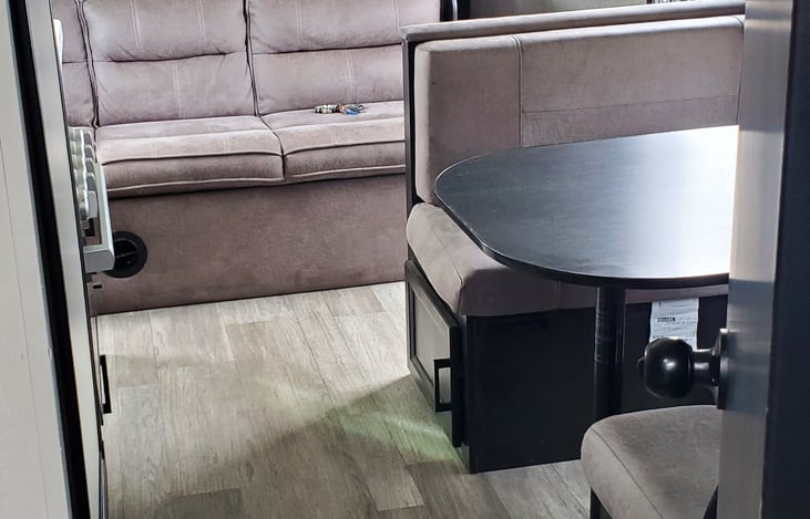 dinette table, couch, both turn into beds