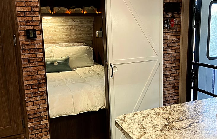 Sliding faux barn door for the master bedroom...because everyone wants to feel like they are in a farmhouse then they are in a trailer, ha ha.