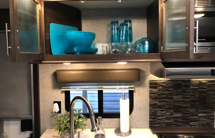 Fresh roll of paper towel, dish soap and new sponge is always included