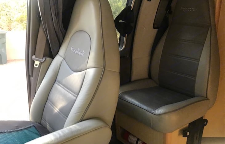 Rear jump seat converts to a sleeping bed.