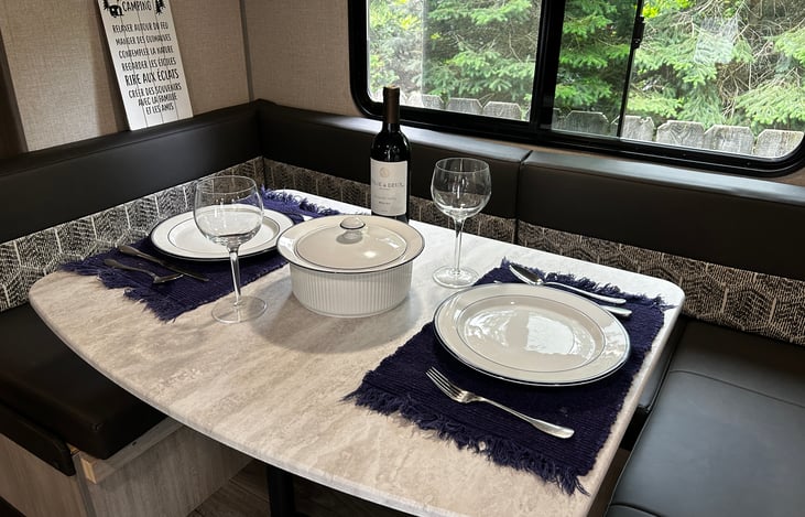 Dining table which converts to a bed