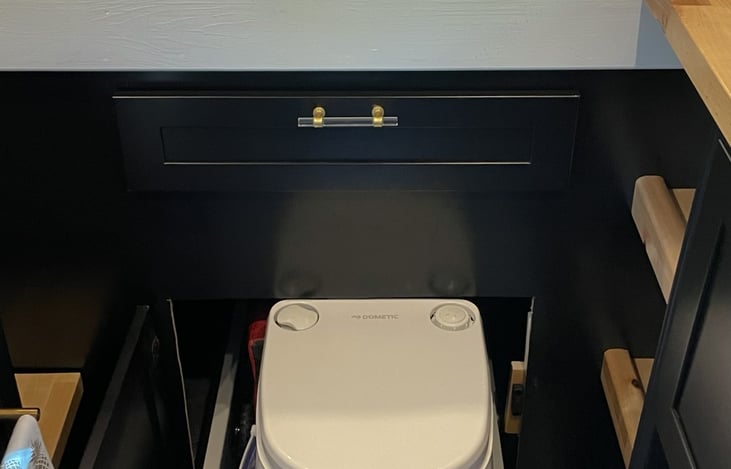 Cassette toilet. No smell. Can be dumped in regular toilet.