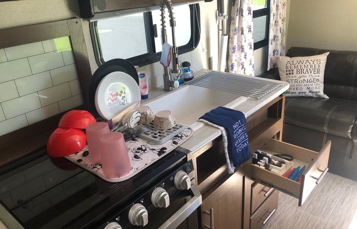 With cabinets with in an arms reach- cabinets above and drawers below makes for easy storage and easy put away.