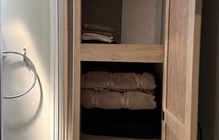 Linen cabinet with towels and washcloths