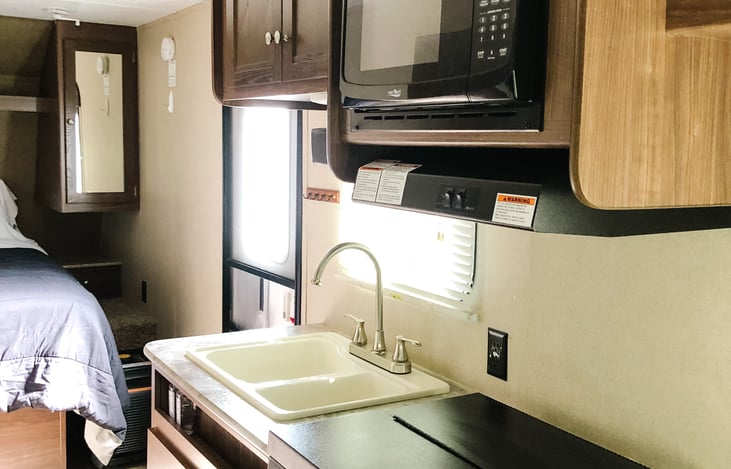 Kitchen with microwave and stove