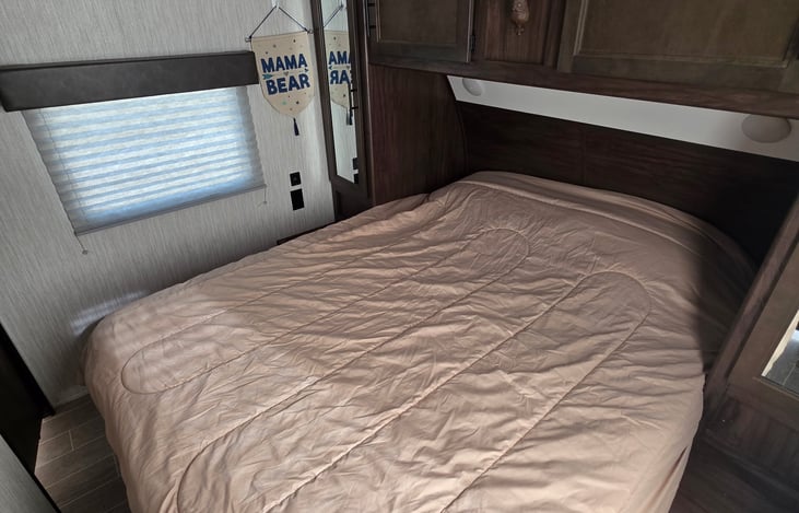 Queen size bed with your choice on the reversible comforter - Terrifically Tan or Captivating Camoflauge