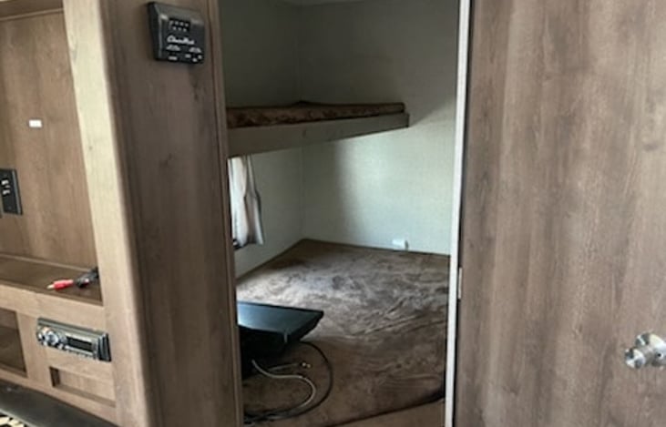 The is the Bunk area with a full size bed on bottom. We usually use the Top Bunk for storage.