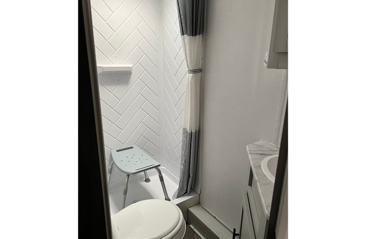 shower seat provided. Great for kids, grandparent, as a step stool to reach the upper bunk for the little ones and great for people over 6' in the shower