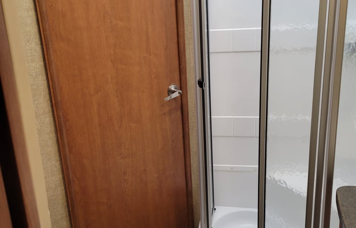 Large shower for a camper! Extra hooks a added to help store what you use or to have wet towels