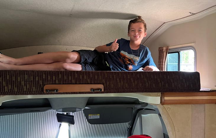 Plenty of space up top, although not sufficient to sit up easily.  You'll want to use the included ladder to get up and down safely.