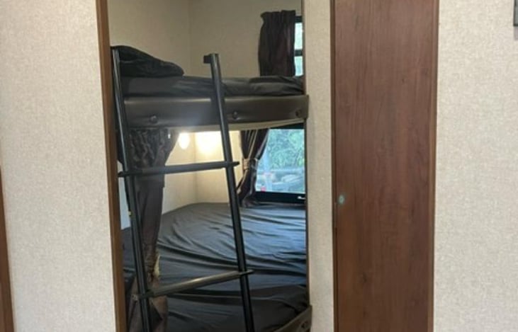 2 full size bunkbeds with windows, bedding included