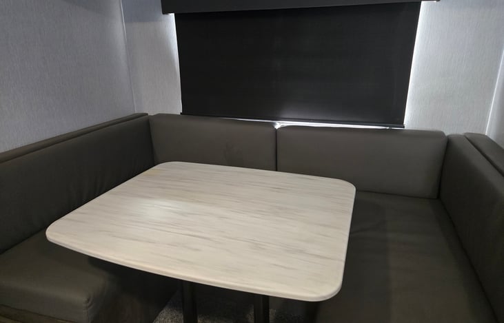 U kitchen table, with storage drawers underneath, Can fold into bed.