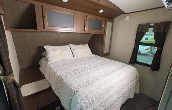 Master Bedroom with TV and access to bathroom.