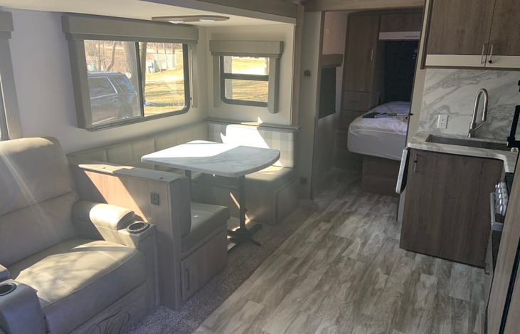 Theater seats with dinning table .
Beautiful inside !