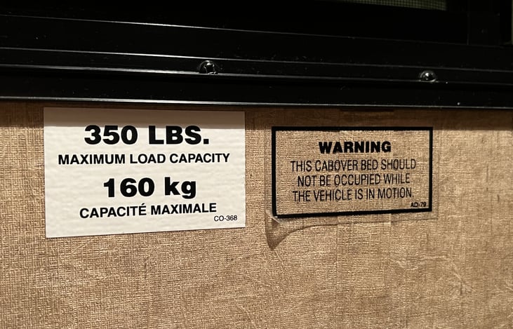 Maximum weight for overhead bunk...though this seems a bit enthusiastic - recommend 300 lbs. max.  You don't want this thing crashing on your heads!