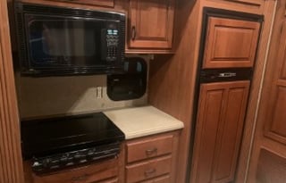 A 5th wheel travel trailer suited for 2 people