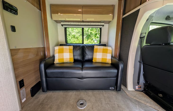 Comfortable leather couch converts to a Twin bed.