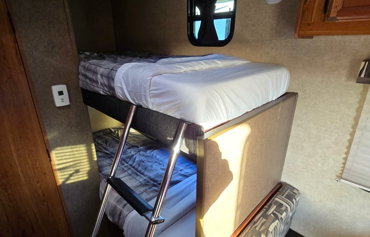Bunk bed features 2 - 6in memory foam twin size mattresses