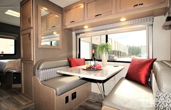 Booth dinette that easily converts into a bed that can sleep up to two!