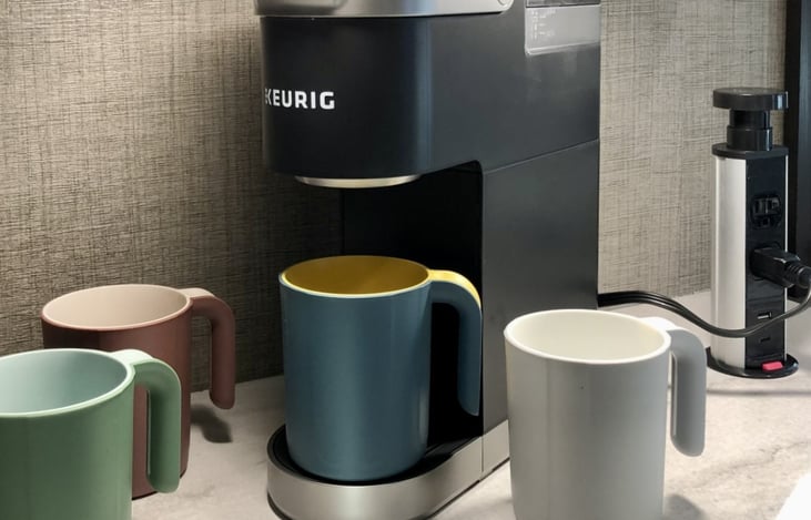Keurig coffee maker, coffee K-cups, and coffee mugs all included.
