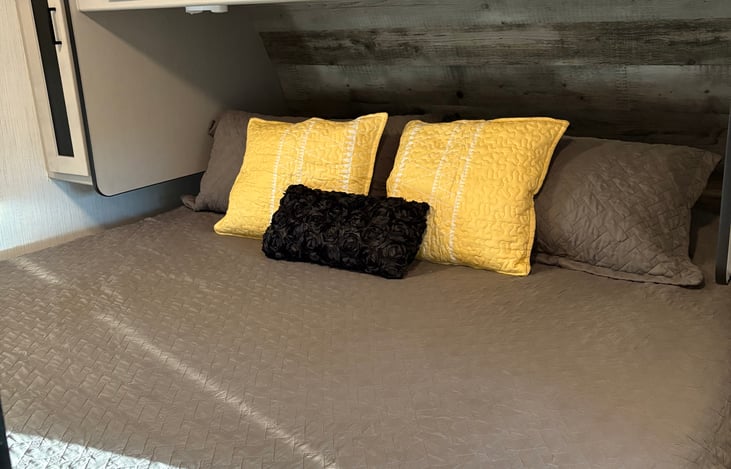King bed with storage behind and underneath it