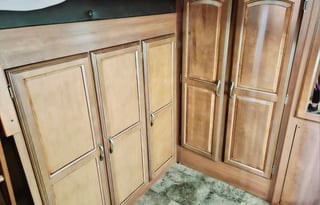 Large RV with outdoor kitchen, fireplace, and TVs